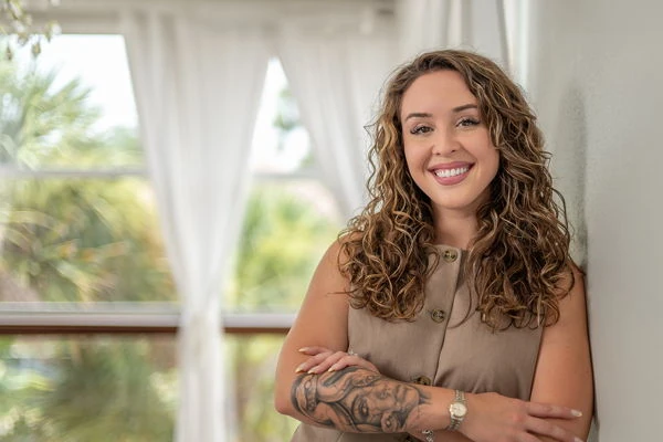 On-location professional headshot with natural light and a softly blurred background
